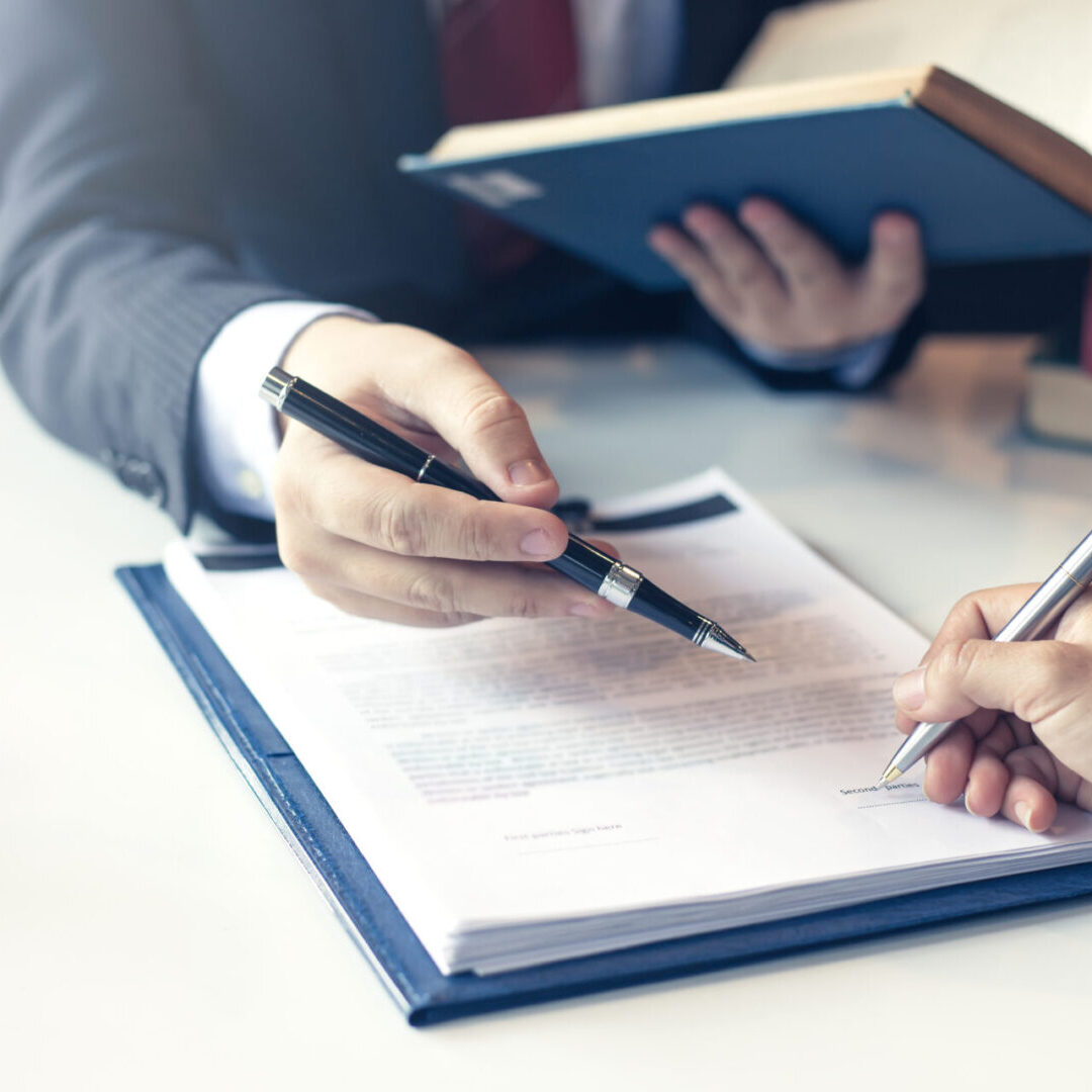 Lawyer pointing to the form signing of the contract agreement.